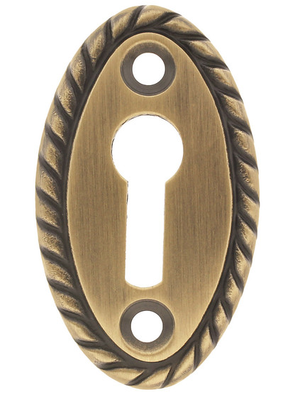 Rope Pattern Brass Keyhole Cover - 1 7/8 x 1 1/8 inch in Antique Brass.